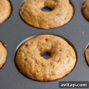 Banana Bread Ring Treats 13 Freshly baked donuts in a non-stick baking pan.