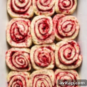 Raspberry roll ups in a white dish.