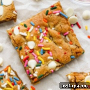 Platter of perfectly sliced White Chocolate Funfetti Blondies with colorful sprinkles, ready to serve.