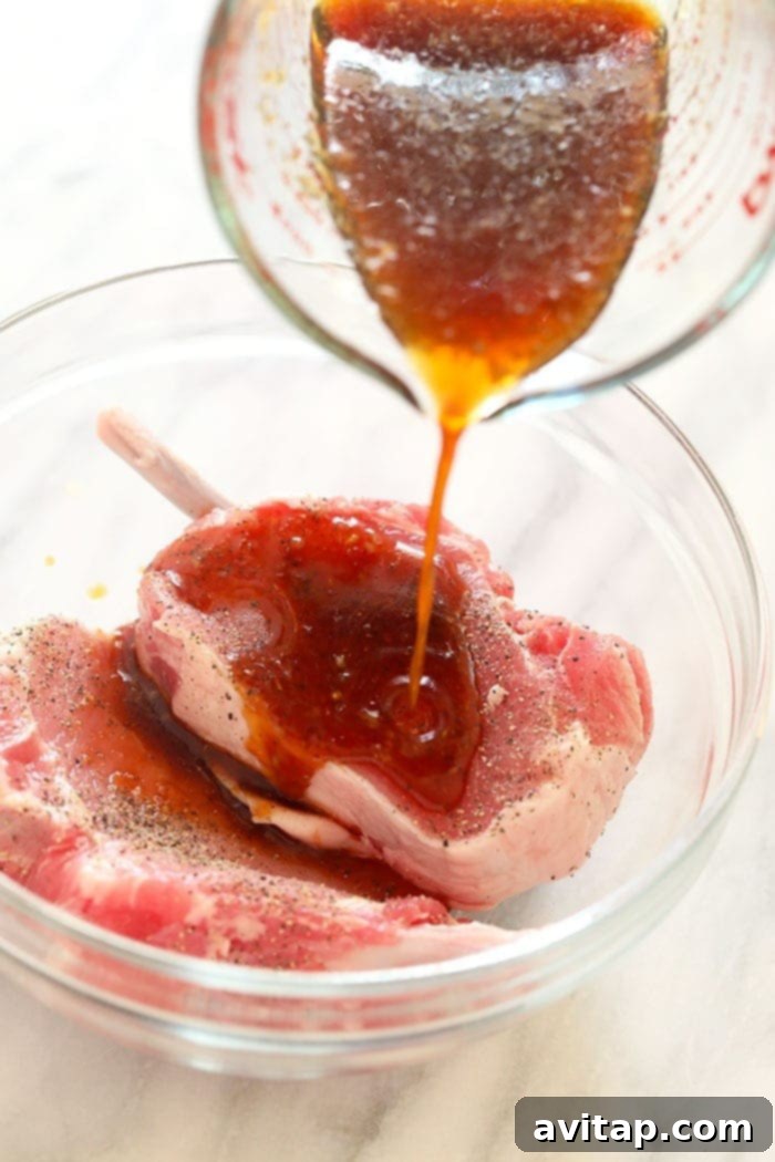 bone-in pork chops soaking in a flavorful marinade