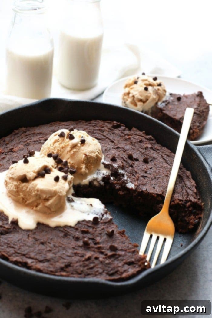 Fudgy Skillet Sweet Potato Brownies topped with ice cream