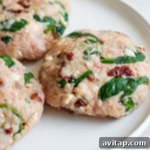 Six perfectly formed Mediterranean burger patties resting on a plate.