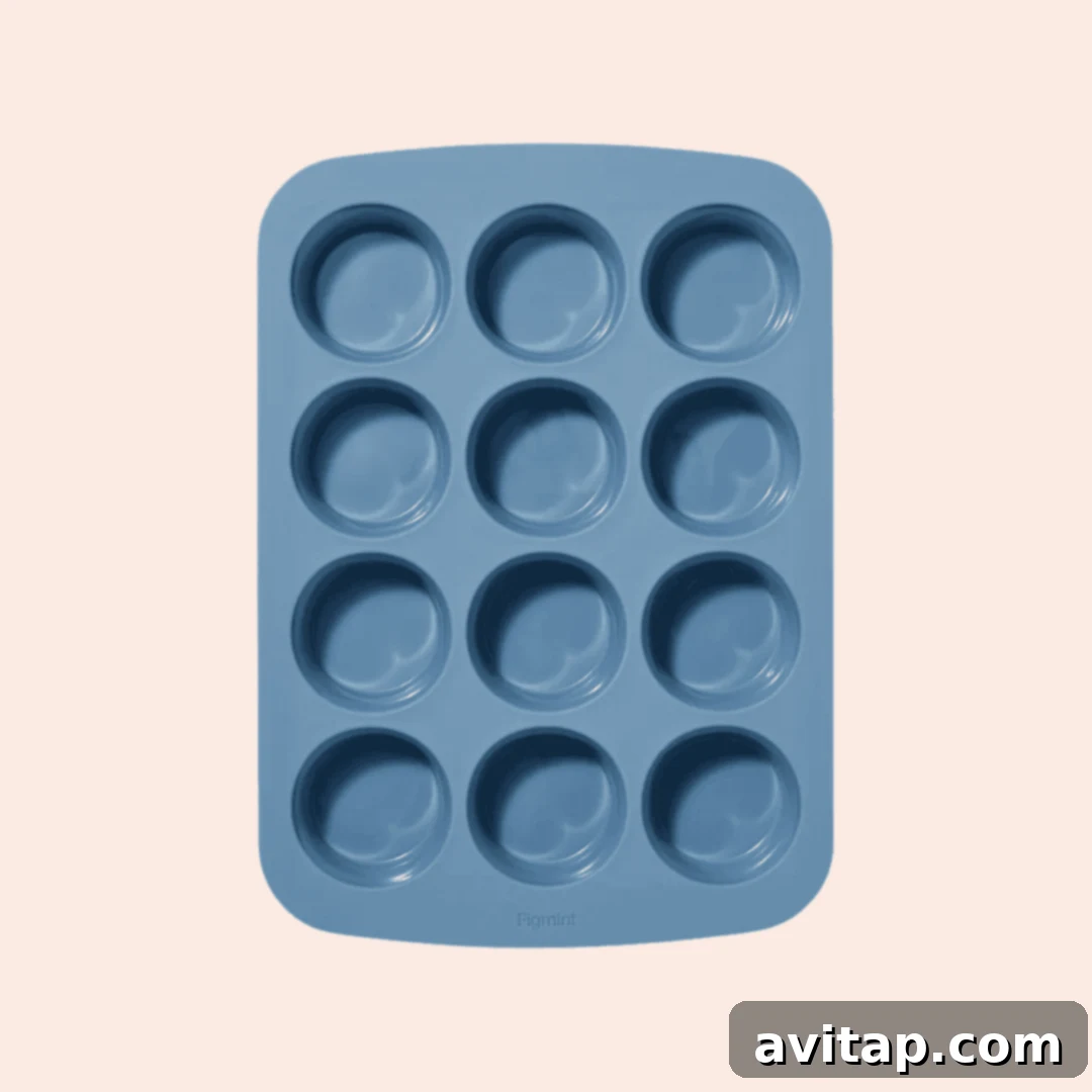 A blue silicone muffin tray with twelve round molds arranged in a three-by-four grid, perfect for no-bake treats.
