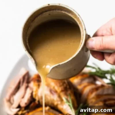 Rich, homemade turkey gravy served in a gravy boat.