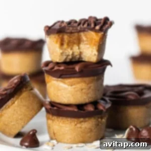 Peanut butter cups stacked on a plate.