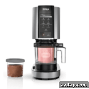 Smooth Chocolate Brownie Protein Dream 3 Ninja ice cream maker with a blend chamber, control panel, and an additional container on the side for creating your own creamy protein ice cream.
