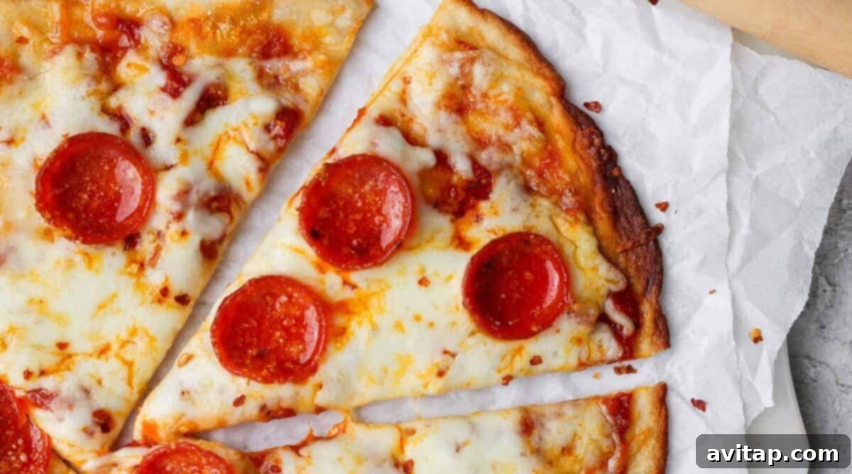 Cozy Fall Protein: Cottage Cheese Delights 3 Slices of pepperoni pizza on parchment paper, featuring a high-protein cottage cheese crust.