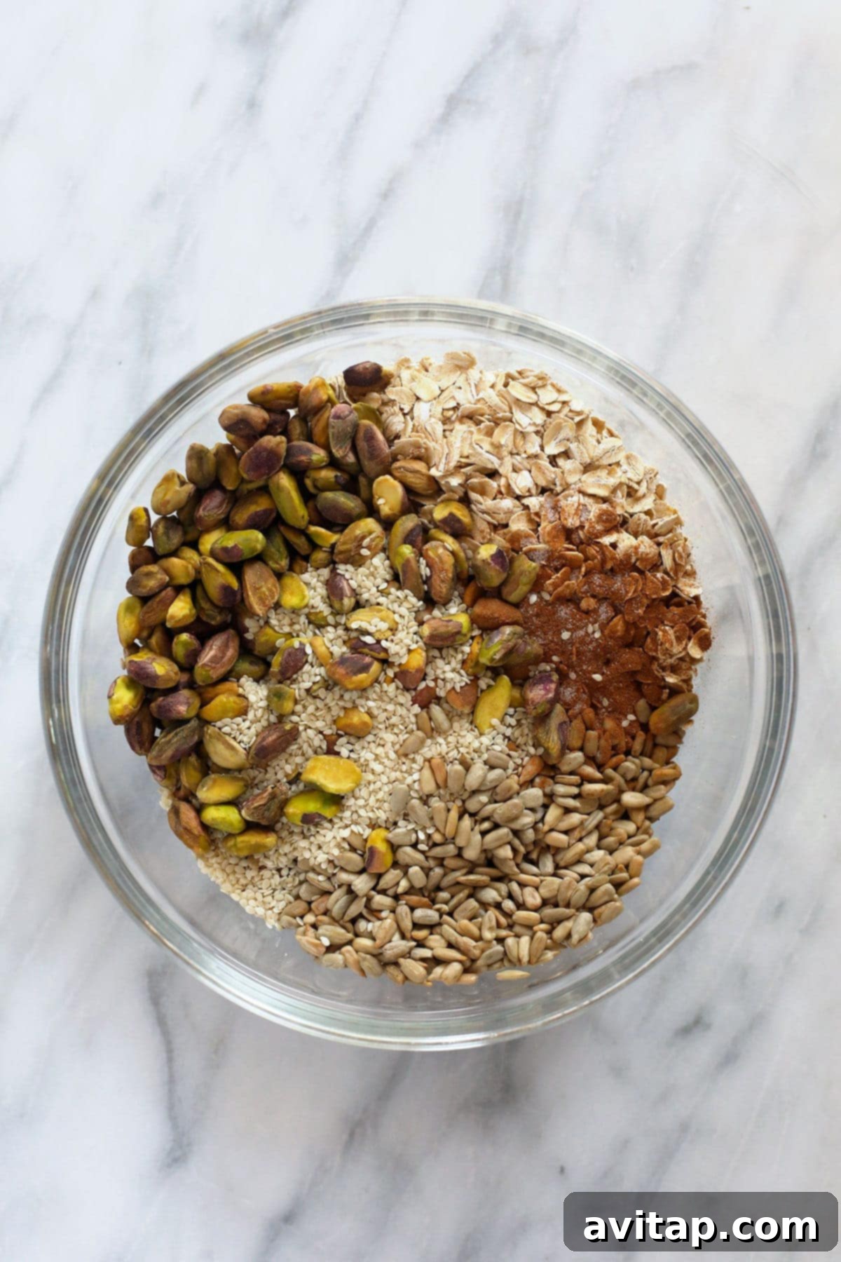 Artisan Pistachio Cherry Granola 3 All of the ingredients for pistachio cherry granola in a bowl.