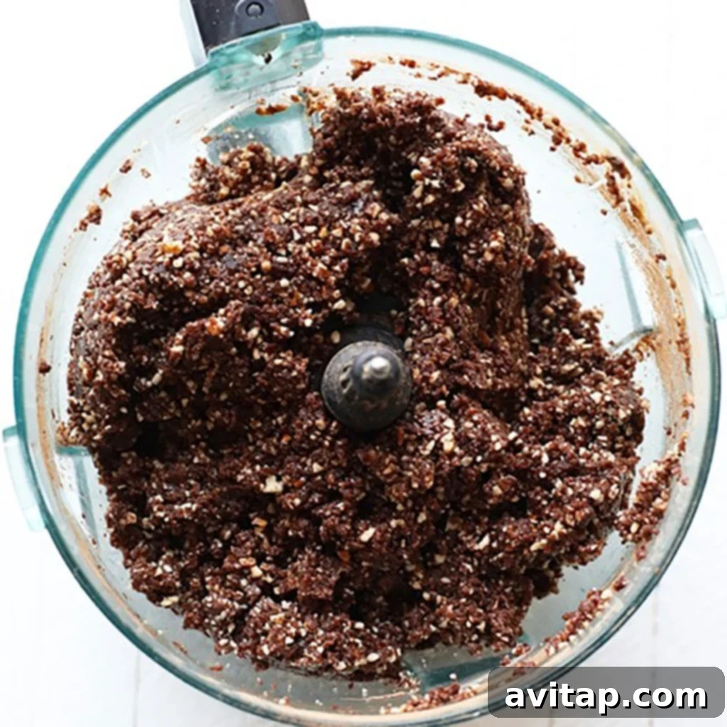 Ground peanut butter brownie balls mixture of ingredients in a food processor.