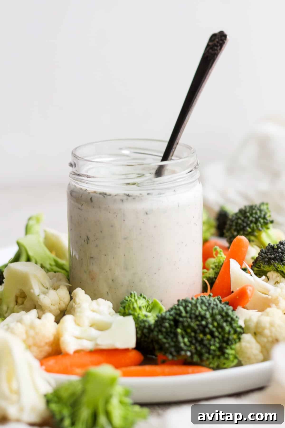 Freshly made ranch dressing in a glass jar, ready to be served.