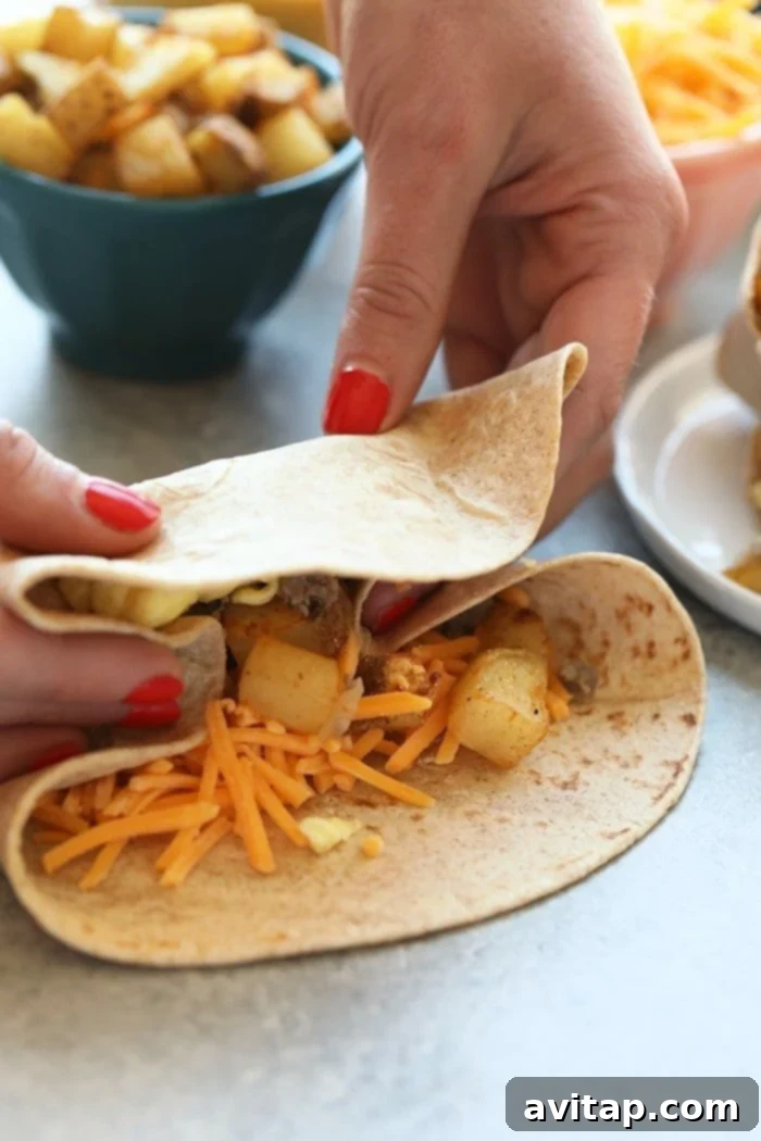 These make ahead breakfast burritos are the perfect grab-n-go breakfast choice for your busy mornings. They are packed with veggies and protein to keep your energy up all day. Make a double batch of these freezer breakfast burritos for an easy, healthy meal-prep breakfast you can enjoy all week long. Wrapping burrito
