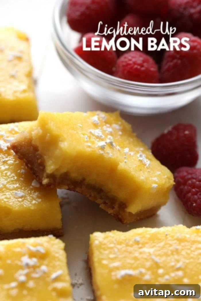 A perfectly sliced gluten-free lemon bar with a bite taken out, showcasing its vibrant yellow filling and delicate crust.