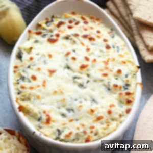 Bubbly Baked Spinach Artichoke Delight 5 Lightened Up Spinach and Artichoke Dip with crackers.