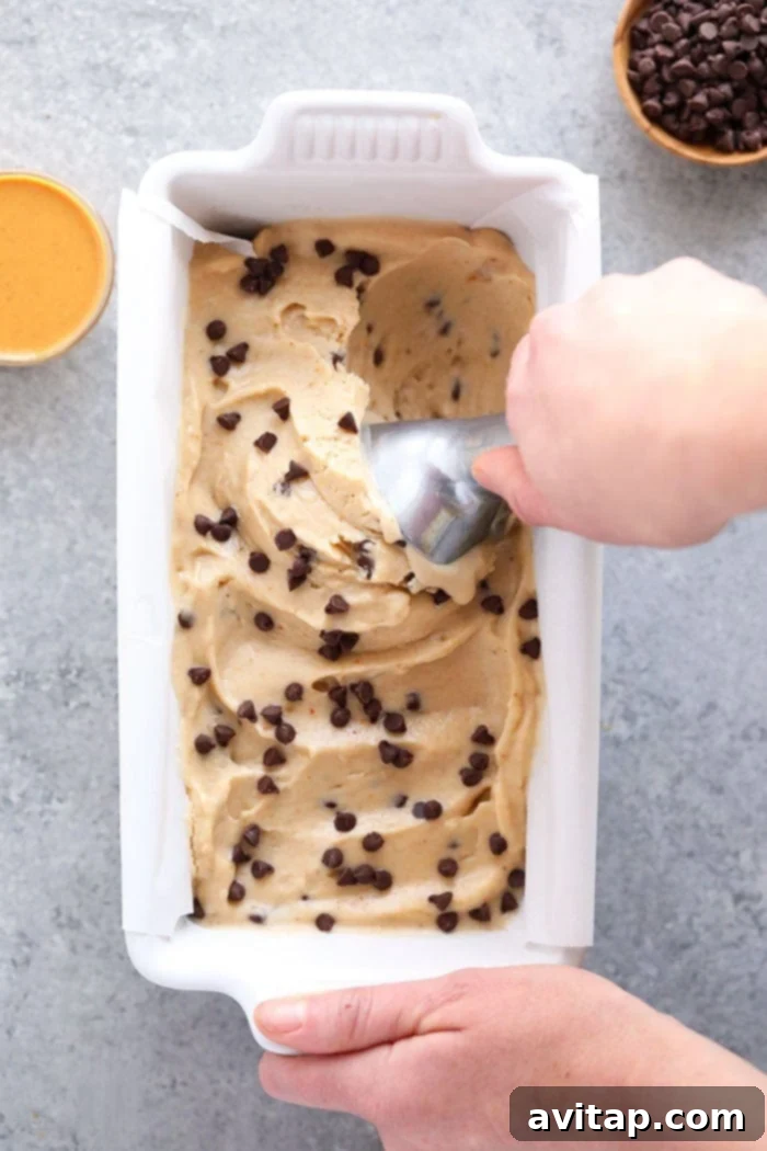 A close-up shot of creamy peanut butter banana nice cream, showing its smooth, enticing texture.