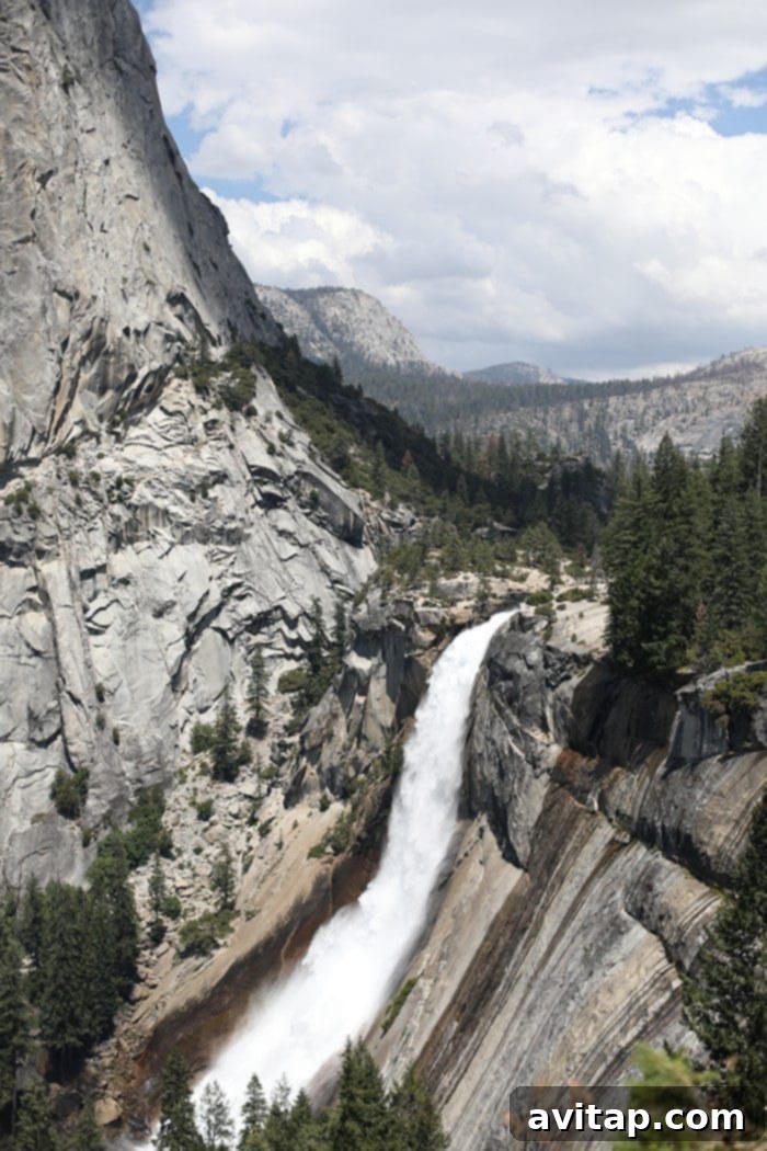 Hikers navigating the wet and misty steps of Vernal Falls in Yosemite