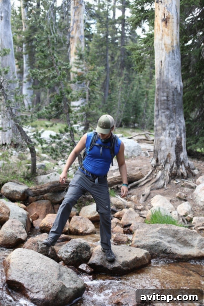 Hikers enjoying a peaceful moment by Cathedral Lake in Yosemite's High Sierra