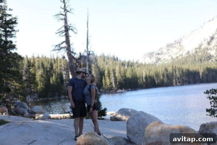 Adventurous hikers crossing a stream on the Tenaya Lake trail after heavy snowmelt