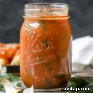 Homemade roasted tomato sauce in a jar.