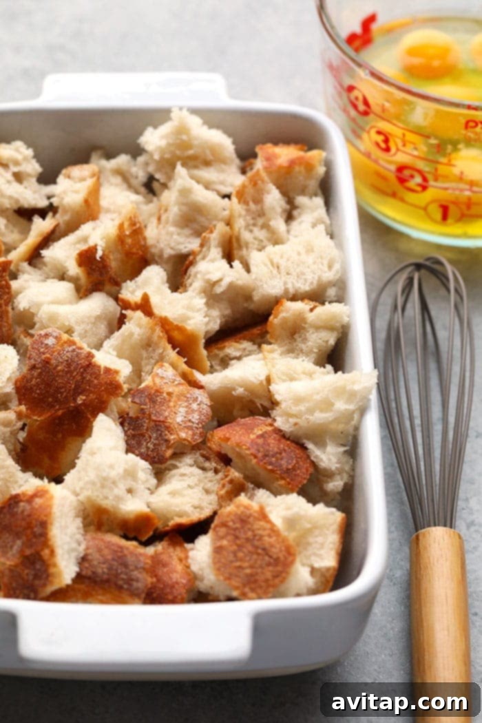 pieces of sourdough bread in casserole dish