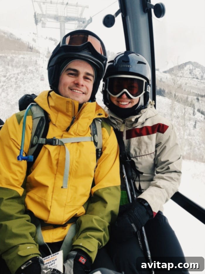 Fit Foodie Travels: Alpine Eats 9 A family enjoying a scenic view during their Park City ski vacation, with snow-capped mountains in the background.