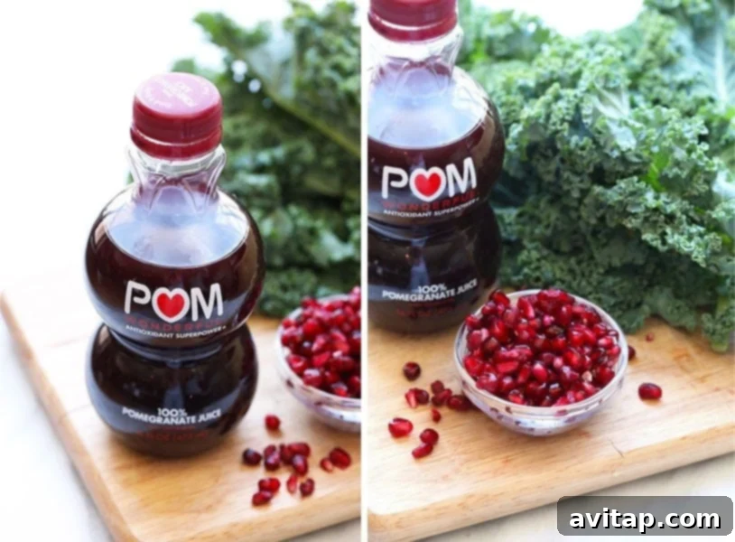 Close-up of POM Wonderful 100% Pomegranate Juice bottle next to a vibrant kale and pomegranate salad, emphasizing the fresh ingredients