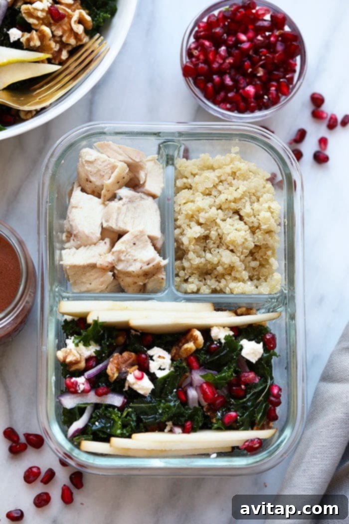 A close-up shot of the finished Pomegranate and Pear Kale Salad, showcasing its vibrant colors and delicious texture, ready to be enjoyed.