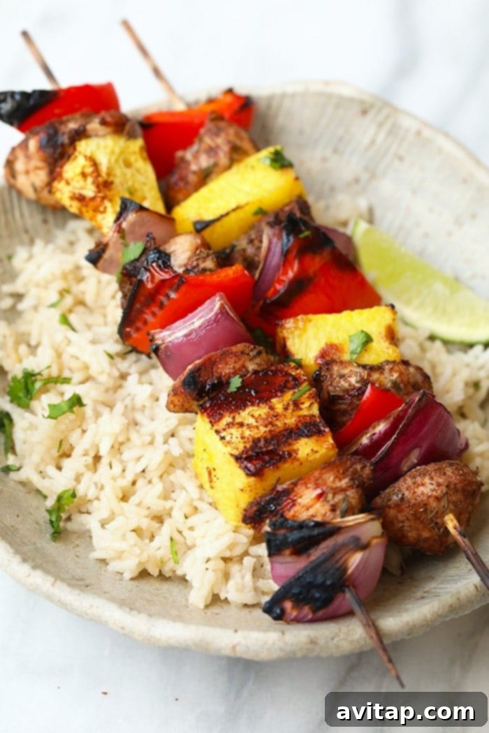 Flavorful Grilled Pineapple and Jerk Chicken Kebabs on a platter, ready to serve