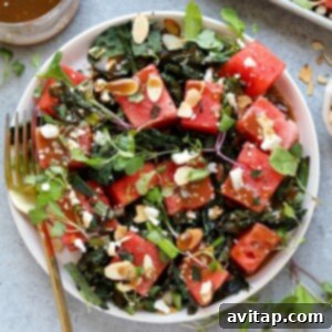 A refreshing watermelon salad with a twist of grilled kale and crunchy almonds, perfect for summer.