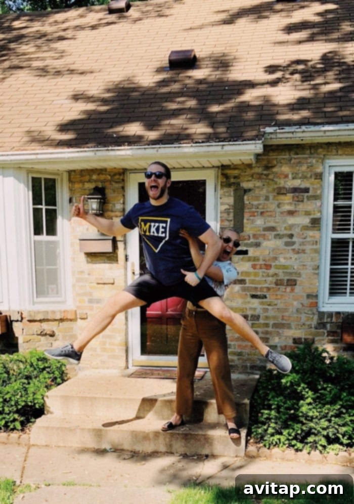 Lee and Mark proudly standing in front of their new Minneapolis home