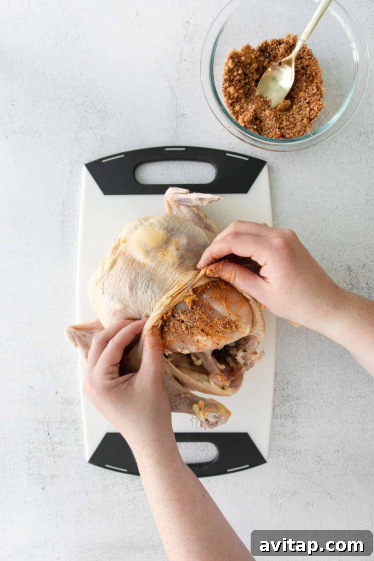 Whole Roasted Chicken: Ready to Carve A whole roasted chicken on a rustic wooden cutting board, garnished with fresh herbs, ready for serving.