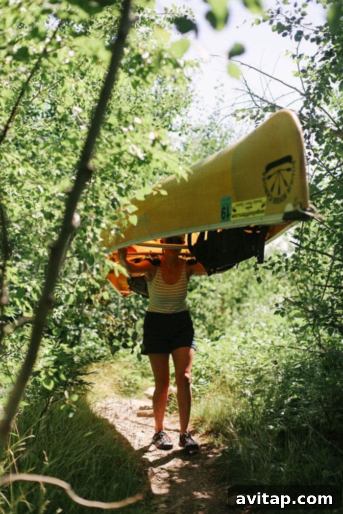 Fit Foodie Finds portaging a canoe in the BWCA