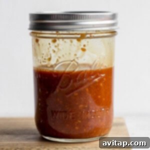 A mason jar filled with an easy homemade stir fry sauce, ready for use in various Asian-inspired dishes.