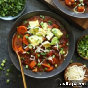 A delicious bowl of Vegan Instant Pot Chili ready to be served, garnished with fresh toppings, showcasing its rich, warm colors.