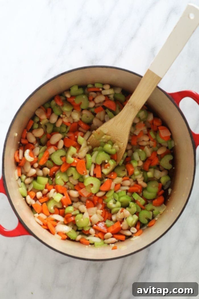 The healthy chicken soup that will make you feel better in an Pinstant. Meet our amazing Chicken Quinoa Soup that's naturally gluten-free, protein-packed, and flavor-filled. chicken quinoa soup in a pot