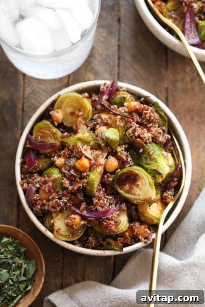 Crispy Roasted Brussels Sprout Quinoa Salad 5 Freshly mixed quinoa salad with roasted Brussels sprouts, chickpeas, and red onion, tossed with dressing.