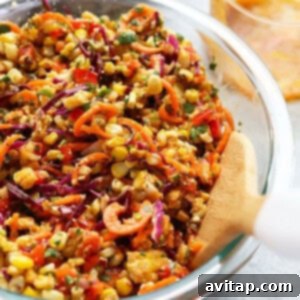 Close-up of corn salad in a bowl, highlighting the fresh textures.