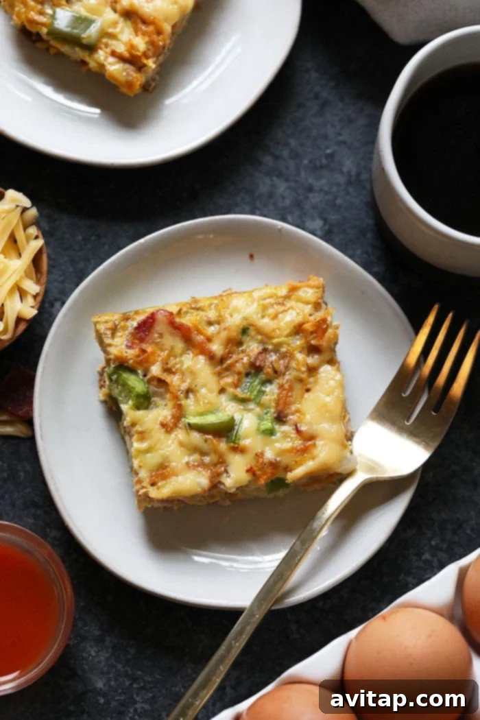 A delectable piece of Sweet Potato Hash Breakfast Casserole on a plate, ready to be enjoyed.