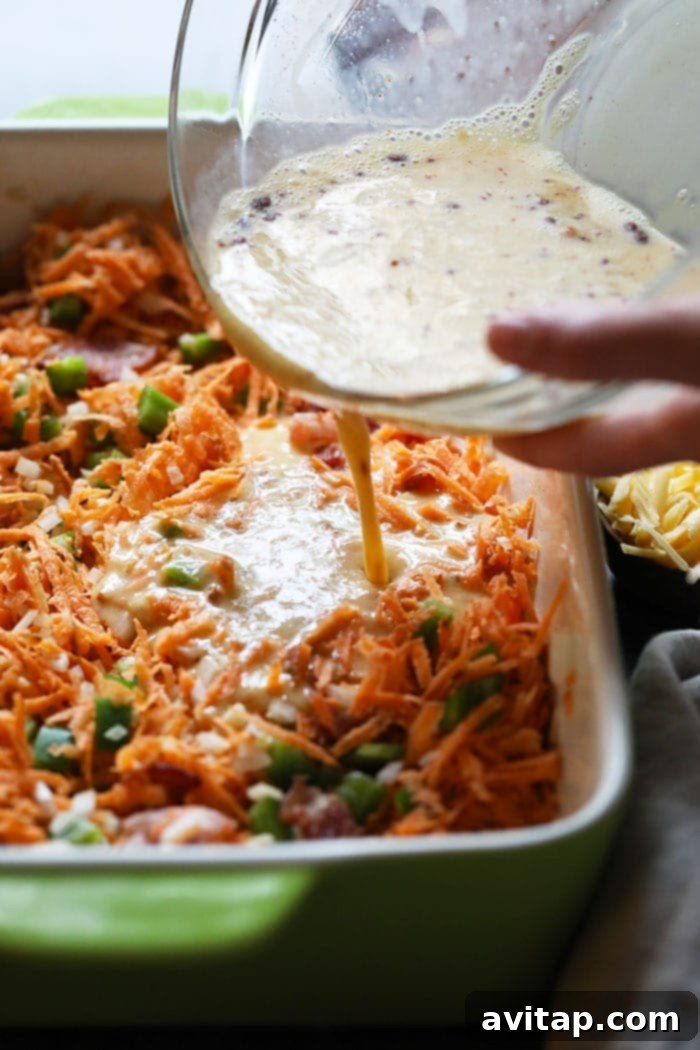 A vibrant close-up of the Sweet Potato Hash Breakfast Casserole, showcasing its rich texture and colorful ingredients.