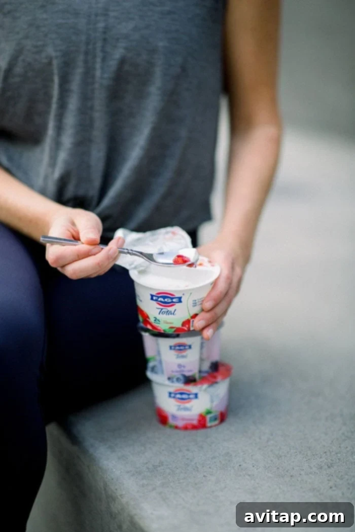 Assortment of FAGE Total Split Cups, showcasing various delicious fruit flavors.
