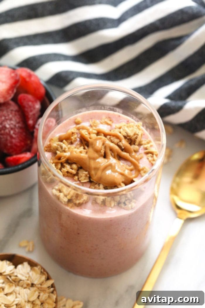 Fuel your morning with this protein-packed, healthy breakfast smoothie. Made with real fruit, oats, protein powder, almond milk, and peanut butter for sustained energy. A glass of healthy breakfast smoothie, rich in protein and fiber, ready to enjoy.