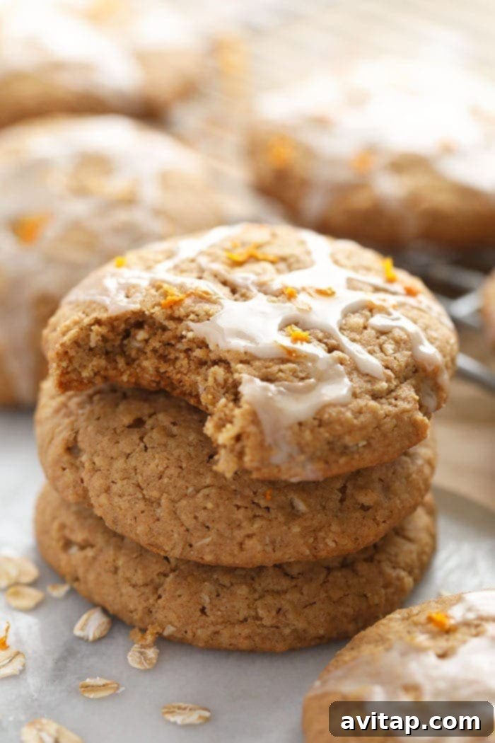 A perfectly iced oatmeal cookie resting on a cooling rack, showcasing its delicate glaze.