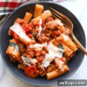 Sausage Pizza Pasta in a white bowl, ready to be eaten.