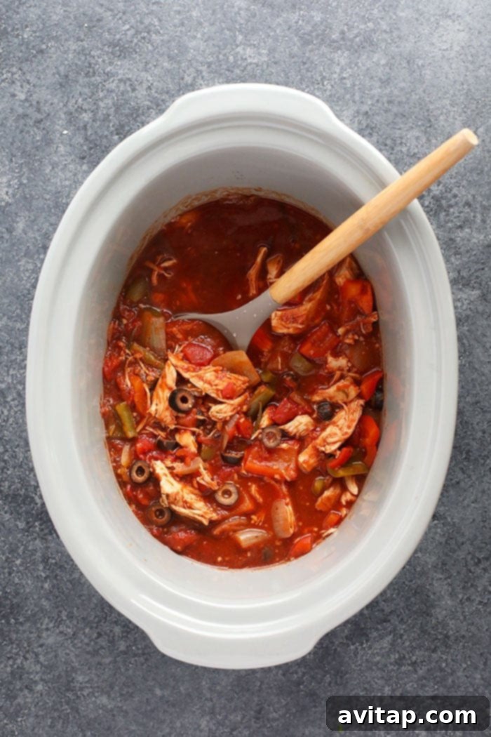Two separate close-up shots of slow cooker chicken cacciatore, showing the rich texture and vibrant colors of the dish, ready to be served.