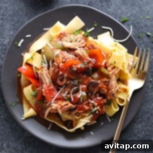Close-up of a serving of slow cooker chicken cacciatore, highlighting the tender chicken and savory sauce.