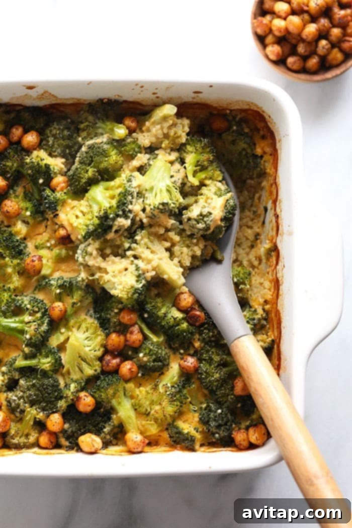 Serving Healthy Vegan Broccoli and Cheese Casserole Scooping a generous portion of healthy vegan broccoli and cheese casserole