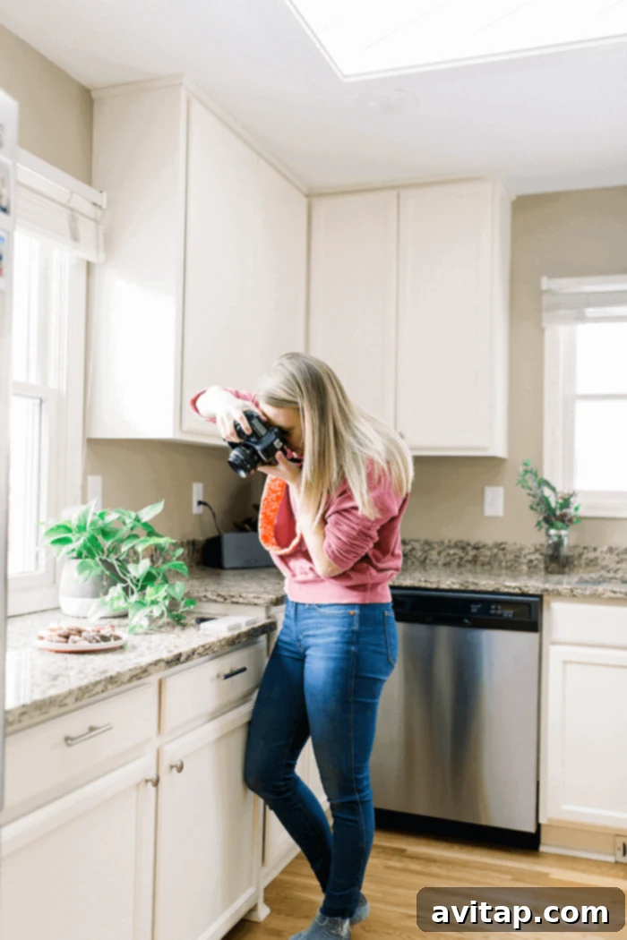 Happy blogger, Lee, enjoying her bright kitchen illuminated by VELUX skylights