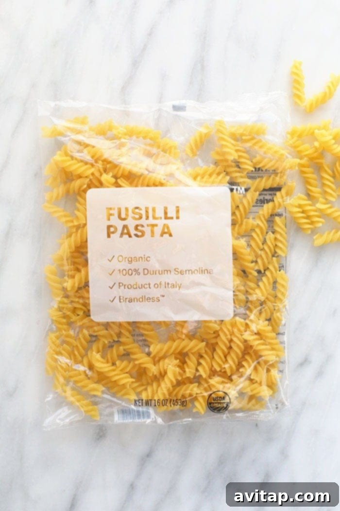 Dried fusilli pasta, ideal for holding rich sauces in a vegan pasta bake.