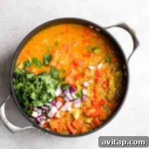 a bowl of indian vegetable stew on a white background.