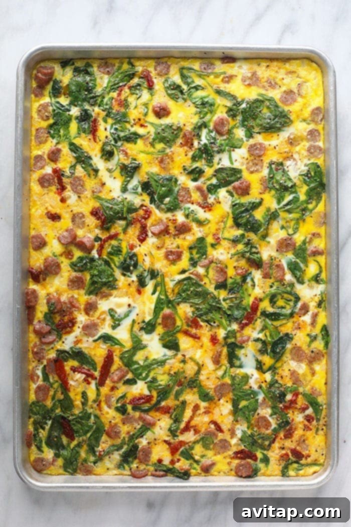 Homemade egg patty cooked on a sheet pan, ready for slicing.