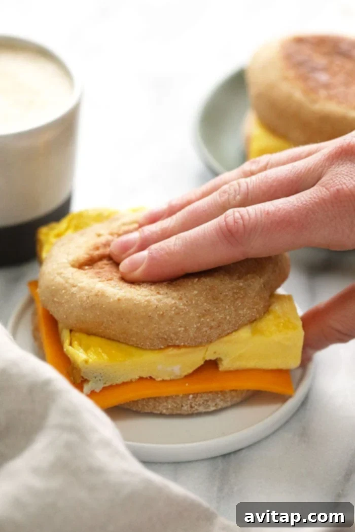 Basic egg and cheese breakfast sandwich on a plate.